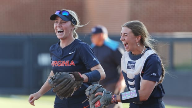 Reece Holbrook and Leah Boggs react on the field during the Virginia softball game against Louisville at Palmer Park.